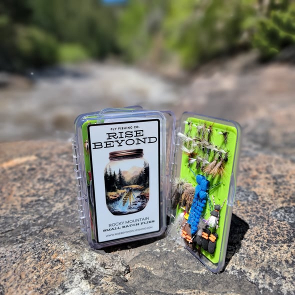 Fly fishing gear with a Griffith’s Gnat beside Boulder Creek near Boulder, Colorado.