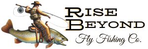Rise Beyond Fly Fishing Co. logo featuring a cowboy riding a large trout, holding a fishing rod in one hand and a camera in the other, with stylized text in a rugged, outdoor-themed font