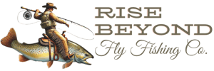 Rise Beyond Fly Fishing Co. logo featuring a cowboy riding a large trout, holding a fishing rod in one hand and a camera in the other, with stylized text in a rugged, outdoor-themed font.