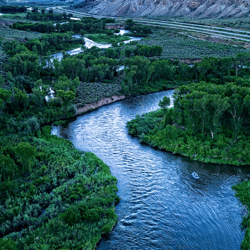 a drift boat floats the colorado river near glenwood springs colorado fly fishing spots