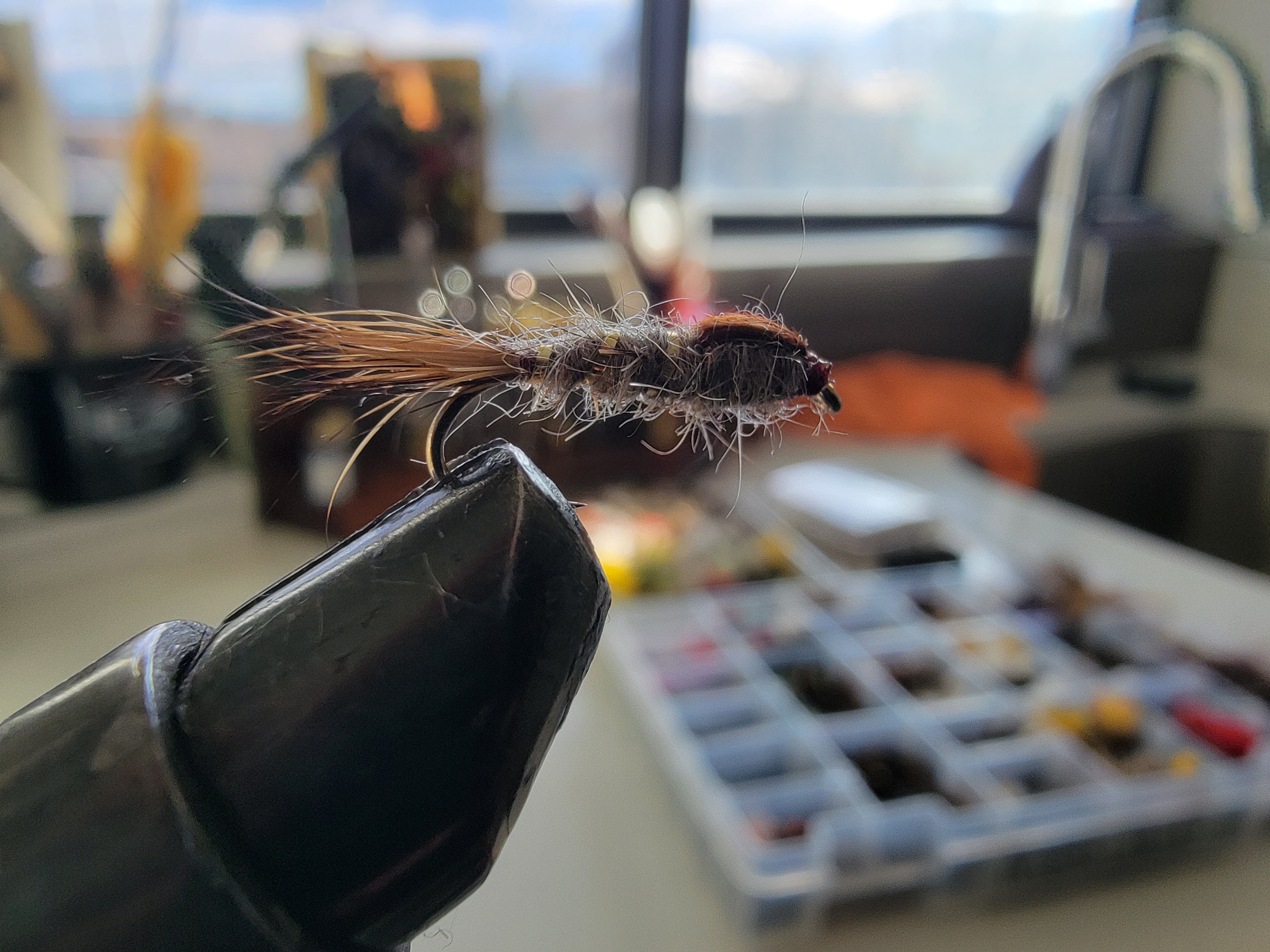 hairs ear nymph with no bead head still on the vice from Rise Beyond Fly fishing company.