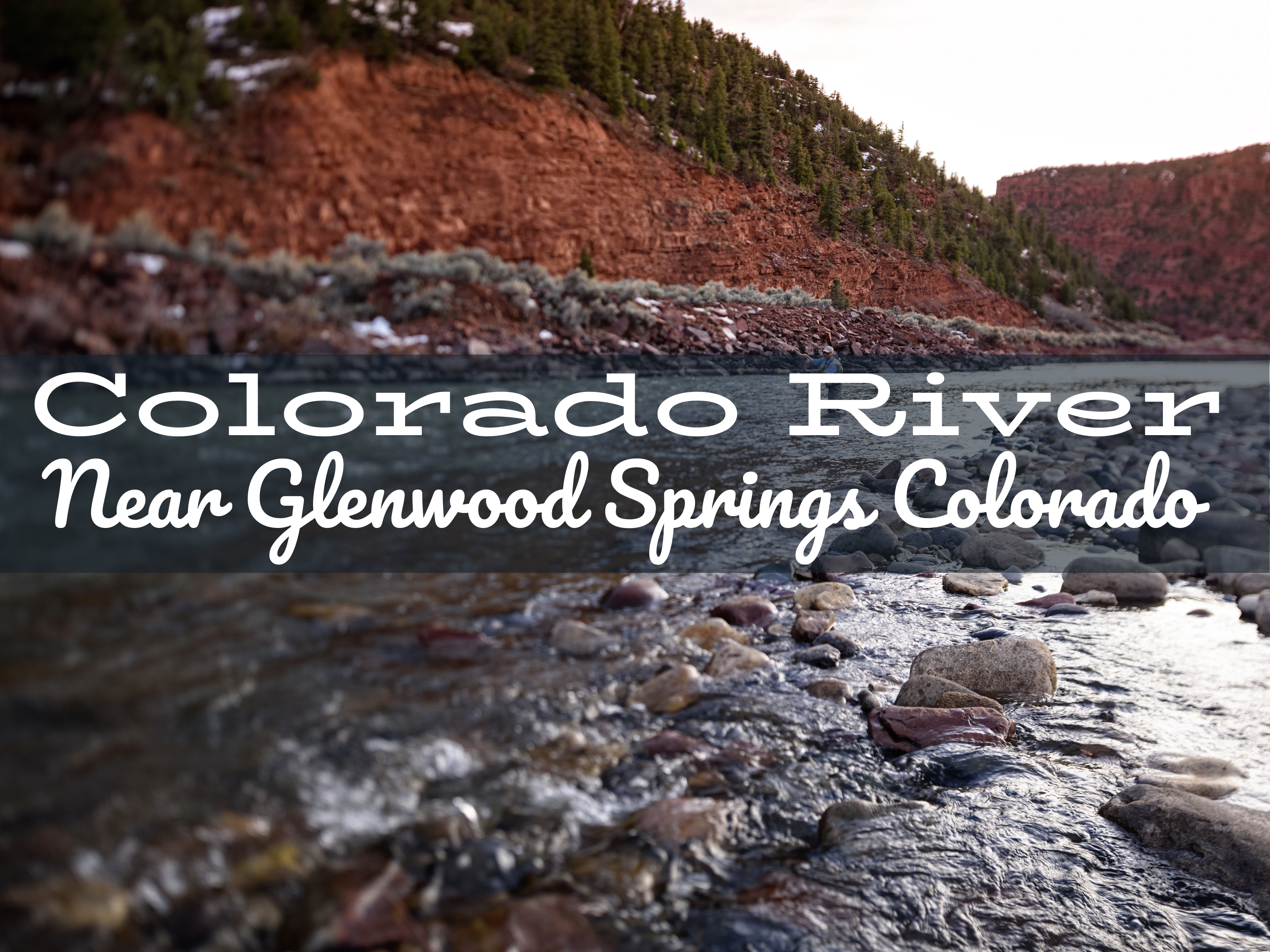 Fly fisherman casting on the Upper Colorado River at the Pumphouse Recreation Area, surrounded by scenic canyon walls and clear, flowing water.