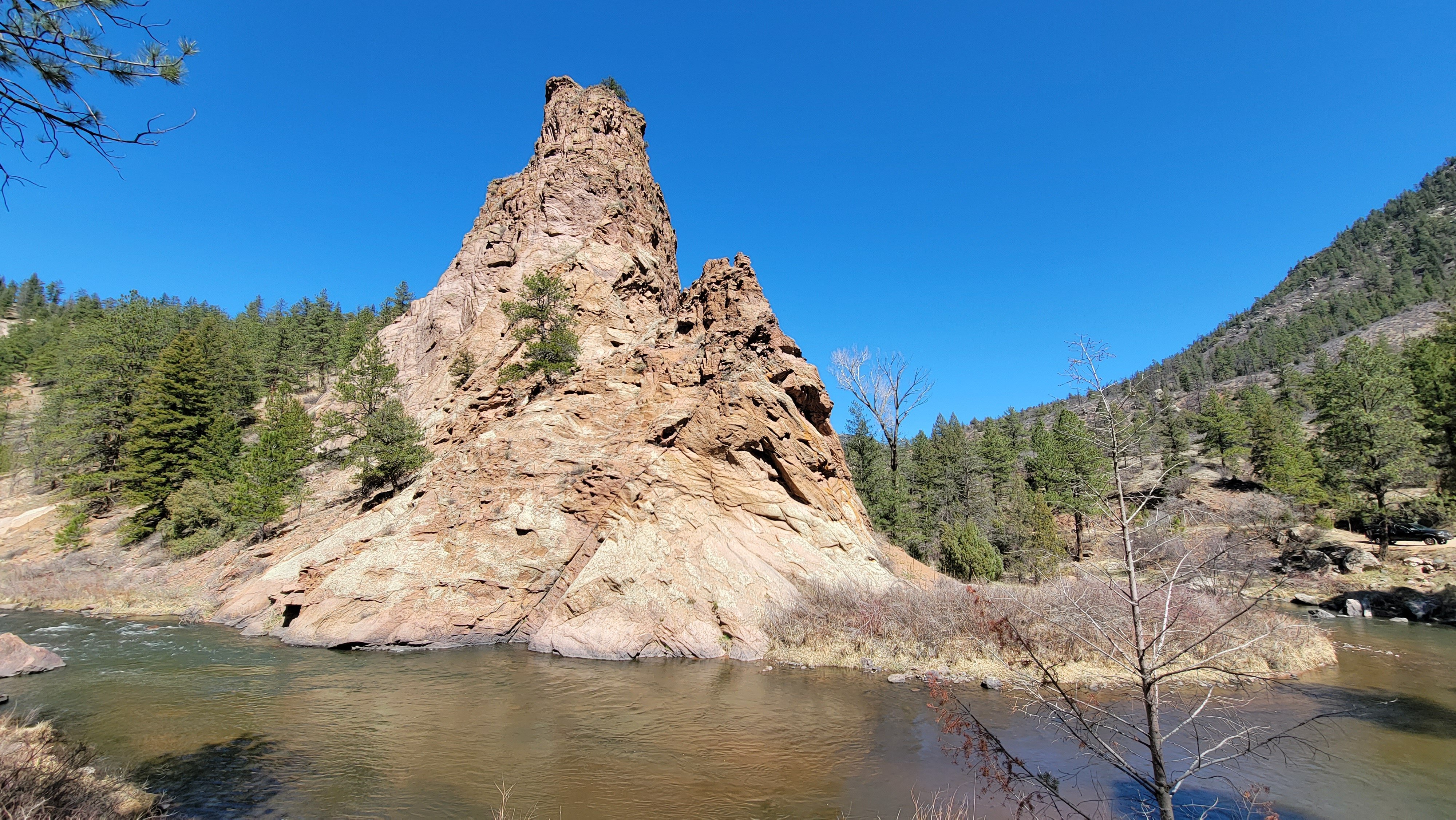 the south platte river at run off. Brown water rolls through the tight canyon of the south platte river near denver colorado. A great fishing spot for quick trips the image shows easy angler access from the road. 