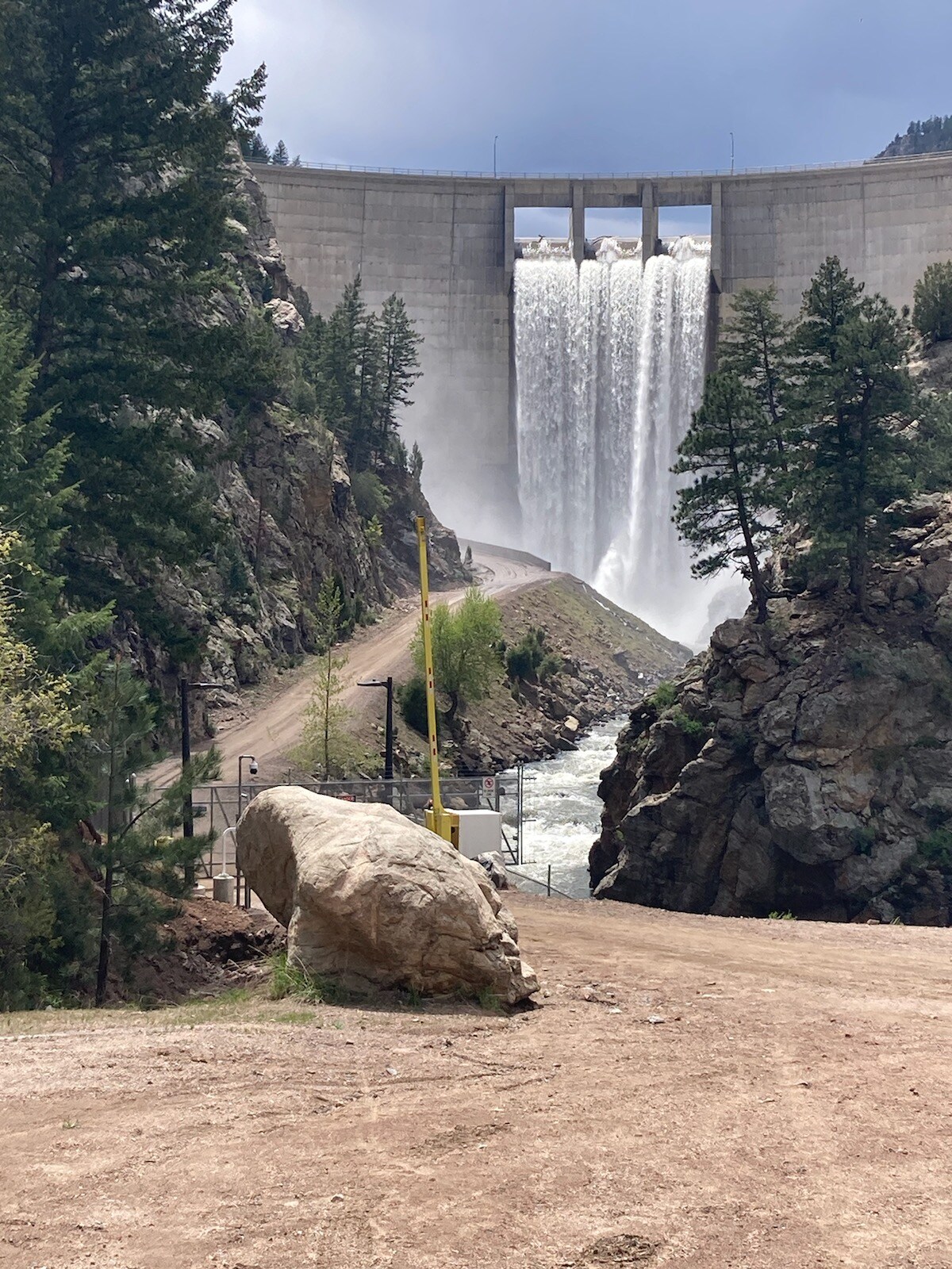 The dam at Stronia Resevior and the head water dam for Waterton Canyon overflowing with water. 