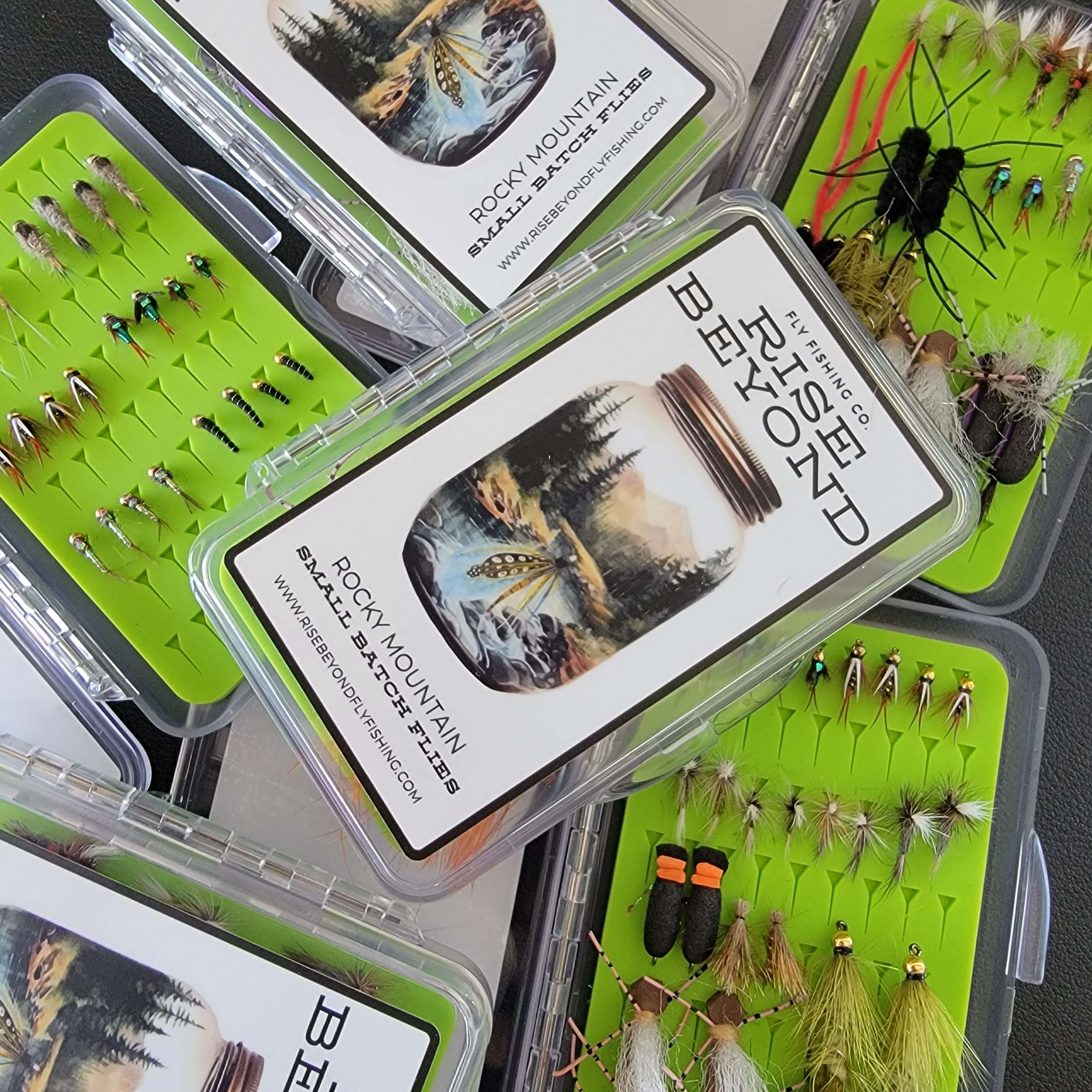 a stack of fly boxes form Rise Beyond