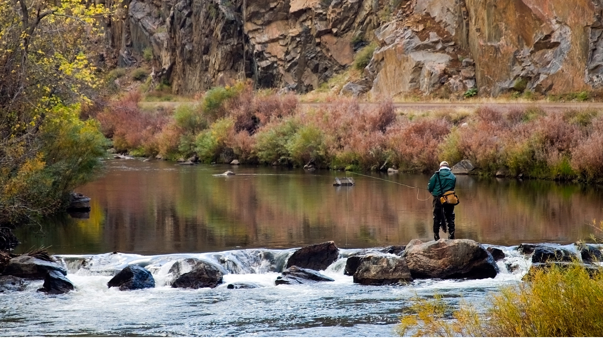 a man fly fishing in cheeseman canyon