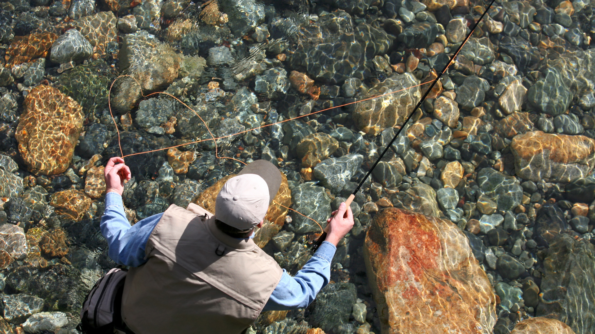 an angler fishing in clear creek based on a fly fishing report form Rise Beyond fly fishing co.