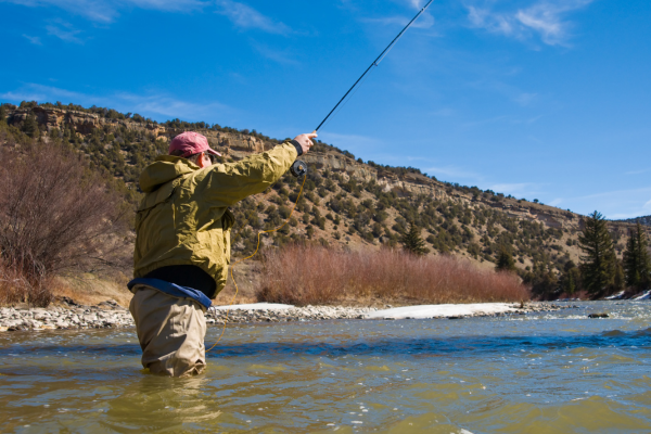 Stay warm and comfortable while fly fishing in Colorado's cooler months with expert tips on layering, gear, and safety.